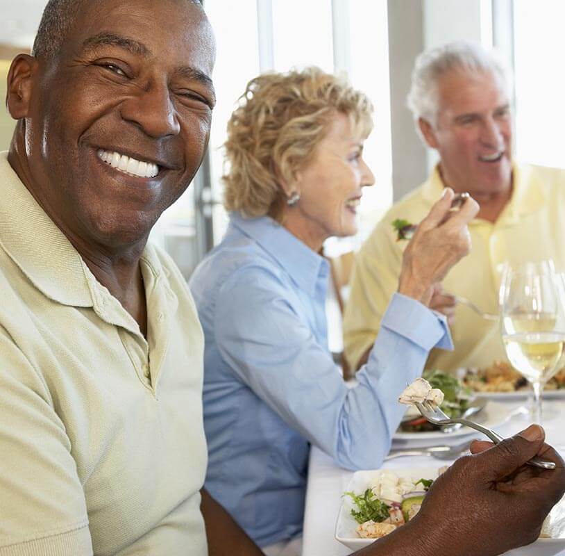 Older people enjoying a meal together