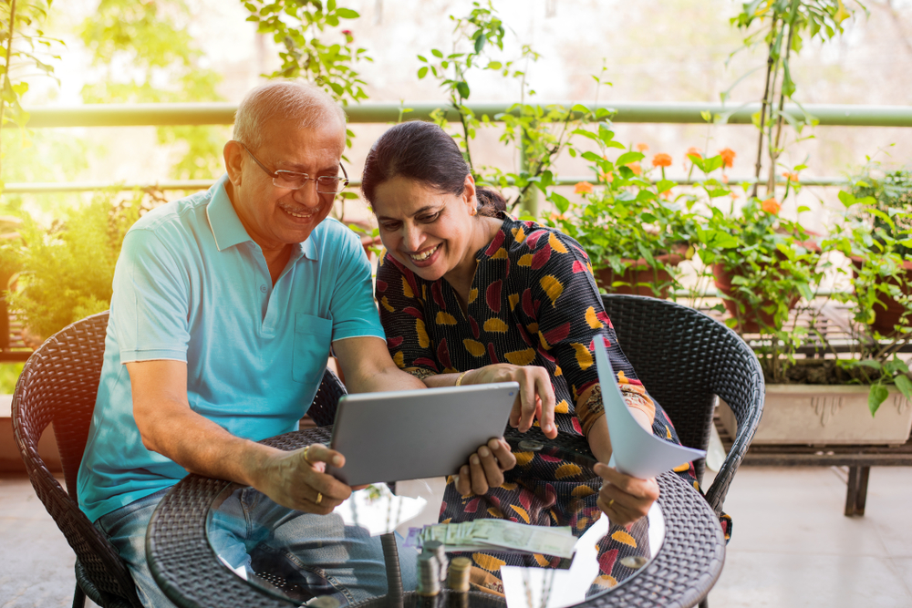 Senior couple looking at tablet